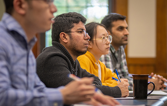 economics class with students looking at front of class