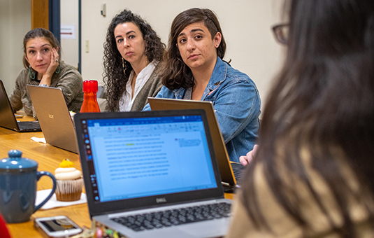 female students discussing something in class