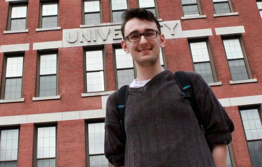 sociology major student standing in front of jonas clark building