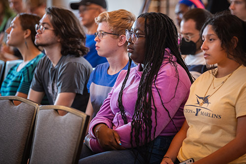 A group of undergraduate students in the audience of the Presidential Lecture Series