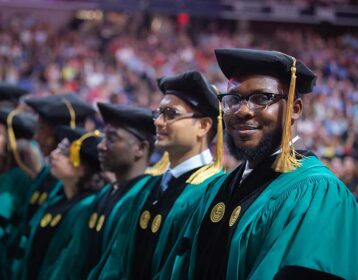 A group of graduate students at commencement