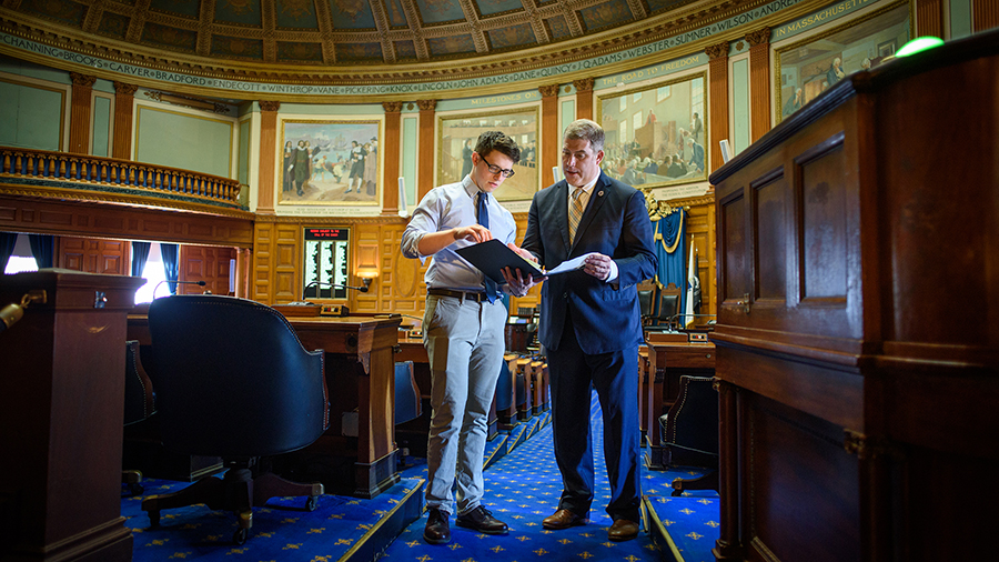 intern going over documents with state representative