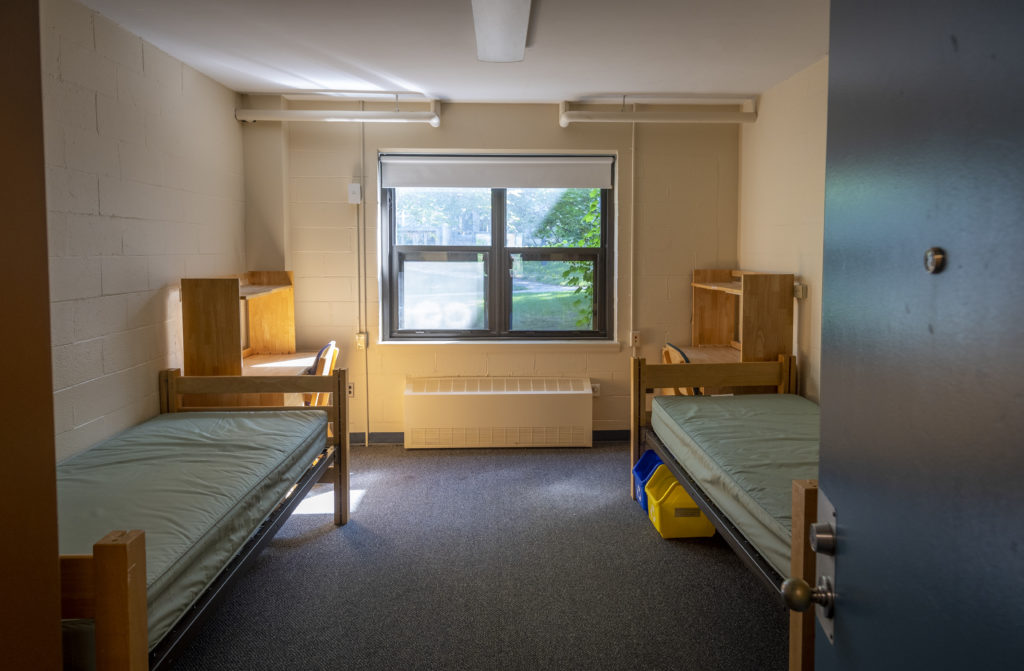 Bullock dorm room with double windows and double beds