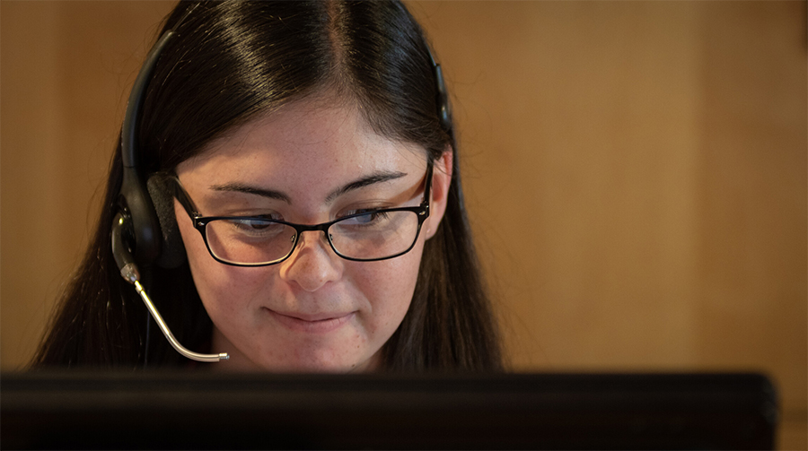 help desk girl on phone with computer