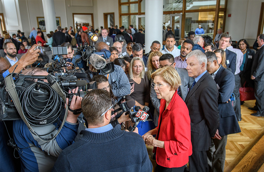 Elizabeth Warren surrounded by media