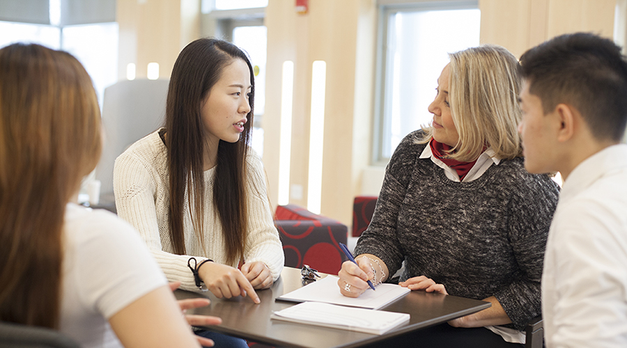 student talking to counselor