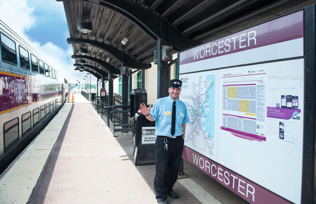 rail road worker standing in front of worcester rails map