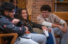 A group of students laughing and smiling during a gathering event of the Men of Color Alliance at 十大网赌平台
