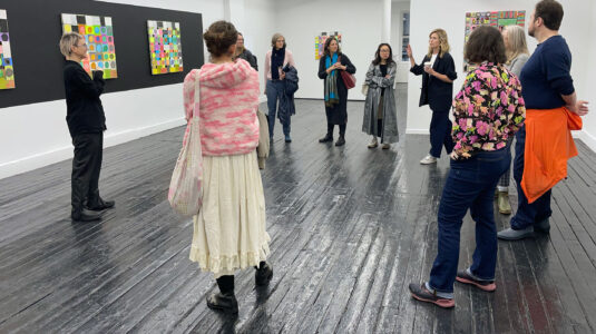 MFA students talking with gallery person in New York City