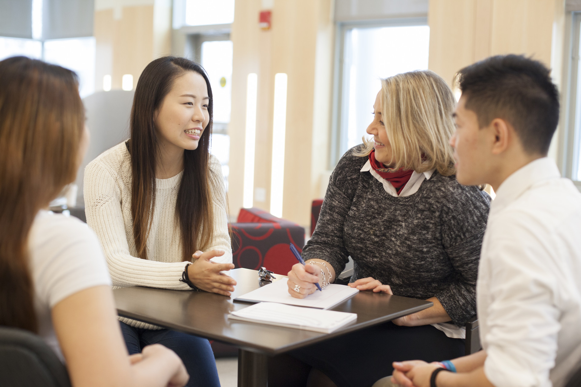 consultant sitting with student