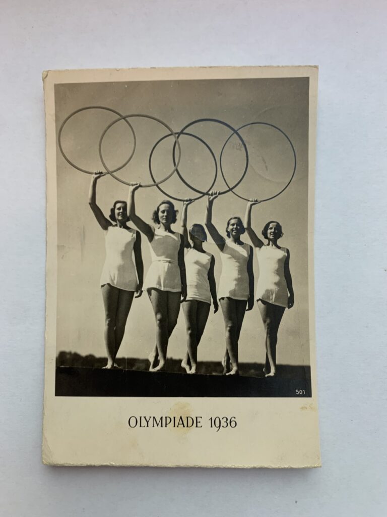Five women holding the Olympic rings for the Berlin 1936 Olympics.
