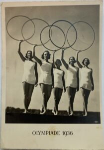 Five women holding the Olympic rings for the Berlin 1936 Olympics.