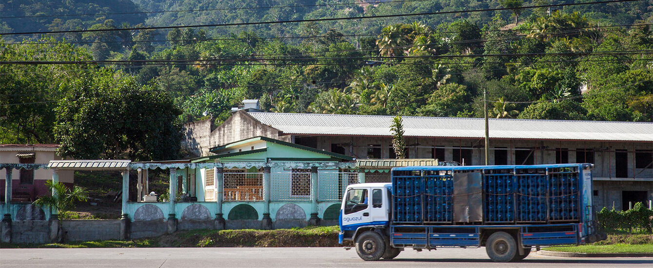 truck carrying water bottles to Jamaica town
