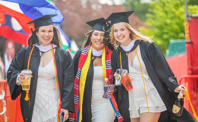 Graduate student females smiling at camera