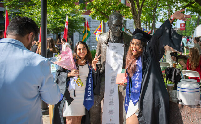 Graduate female students with Sigmund Freud statue