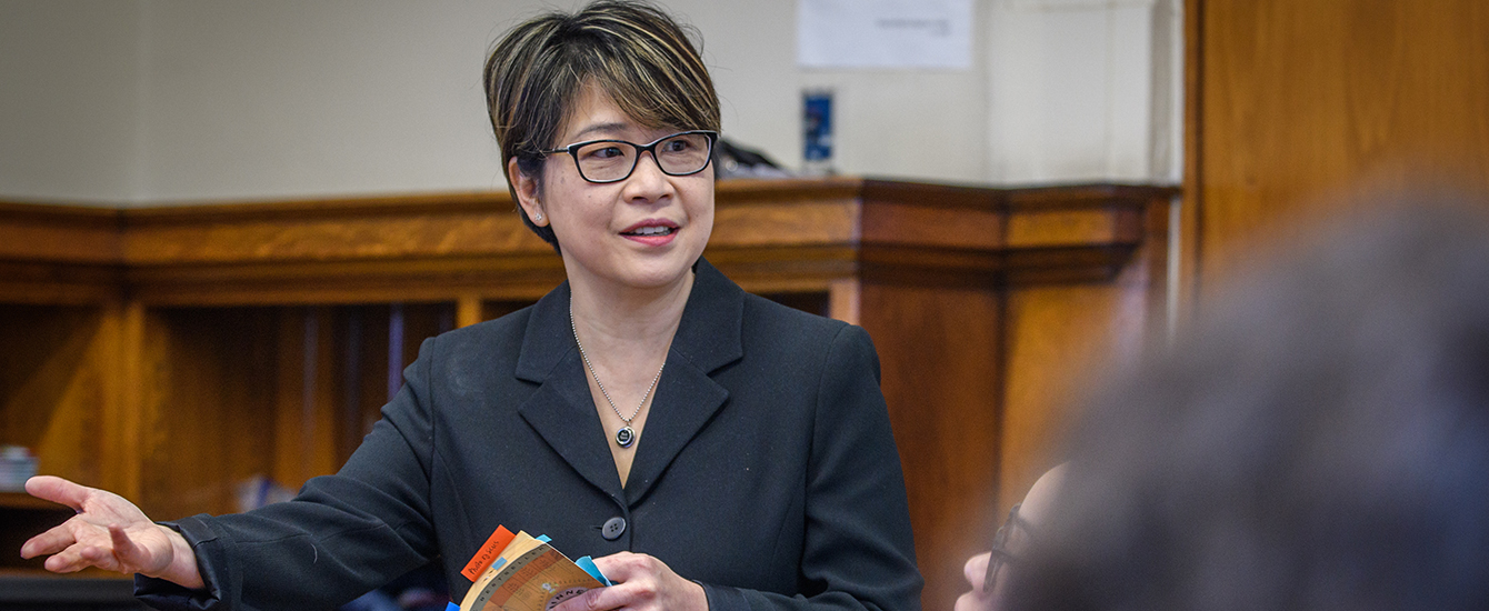 Professor Betsy Huang talks to students in a classroom
