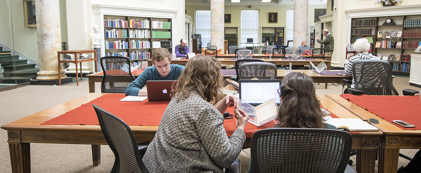 Students and faculty studying in archives