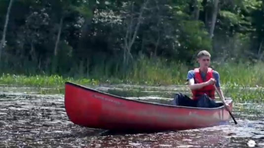 Kasyan Green '21 on a canoe maps Worcester's green spaces.