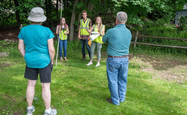 Students discuss residential tree stewardship with homeowners