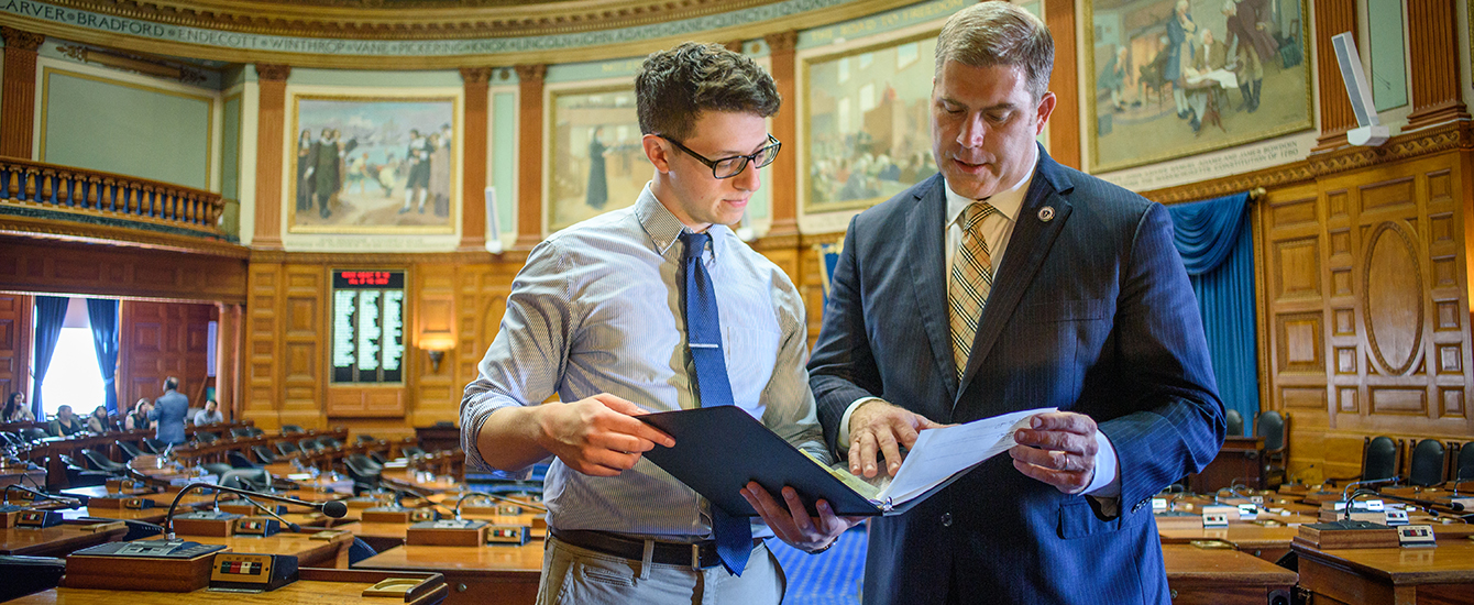 Student working with legislator in State House