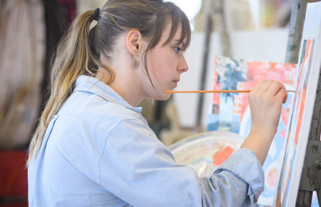 female student painting