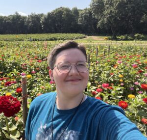 Vesper smiles in a field of flowers