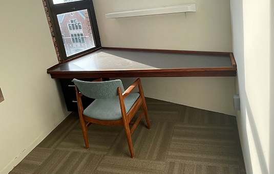 small faculty study room with chair and table
