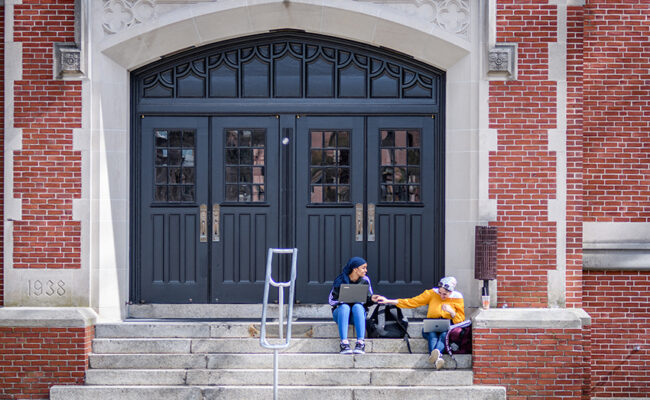 Atwood Hall - girls sitting on front stairs