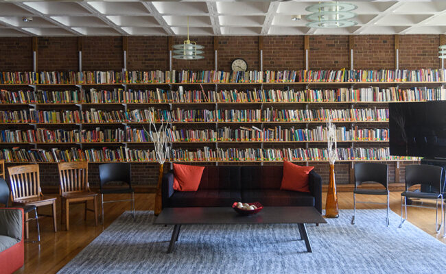Dana Commons - - couch with books behind it