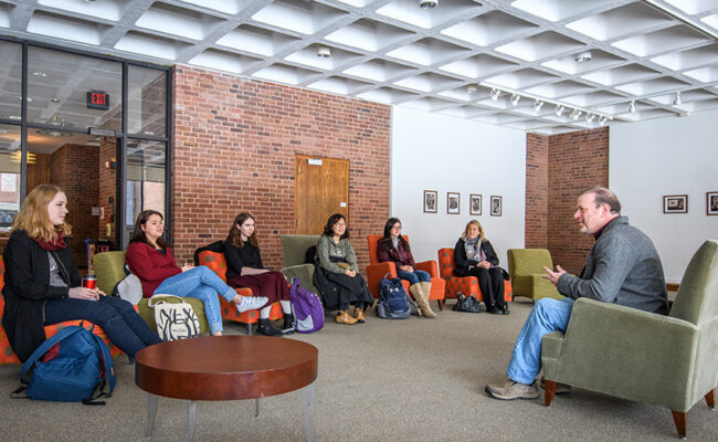 Dana Commons - students meeting in lounge with professor