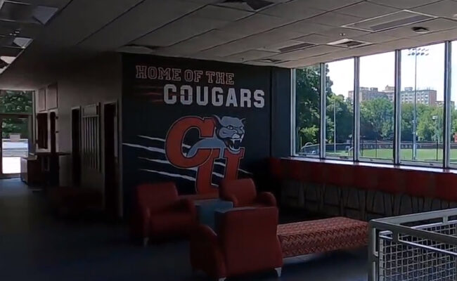 Dolan Field House - inside with clark cougar logo on wall