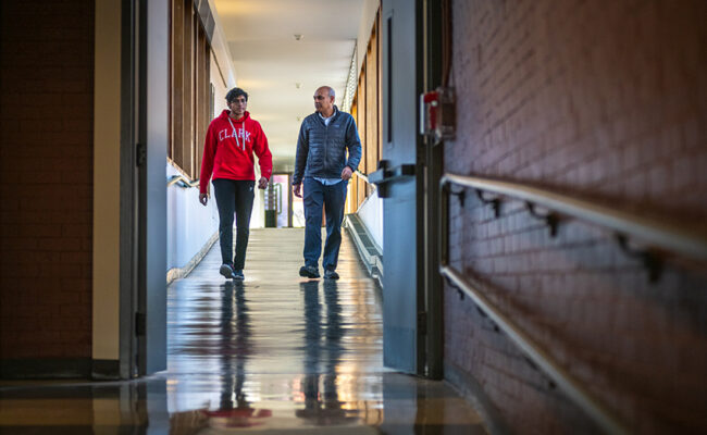 teacher and student walking down hall