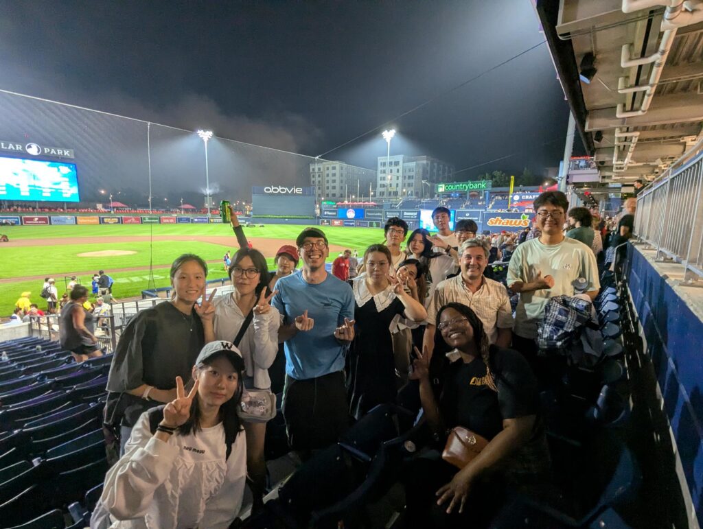 A group photo of HFUT students and friends of Clark University at Woosox baseball game