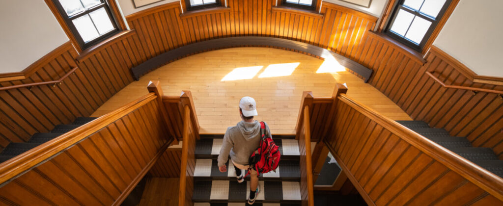 student walking up hall