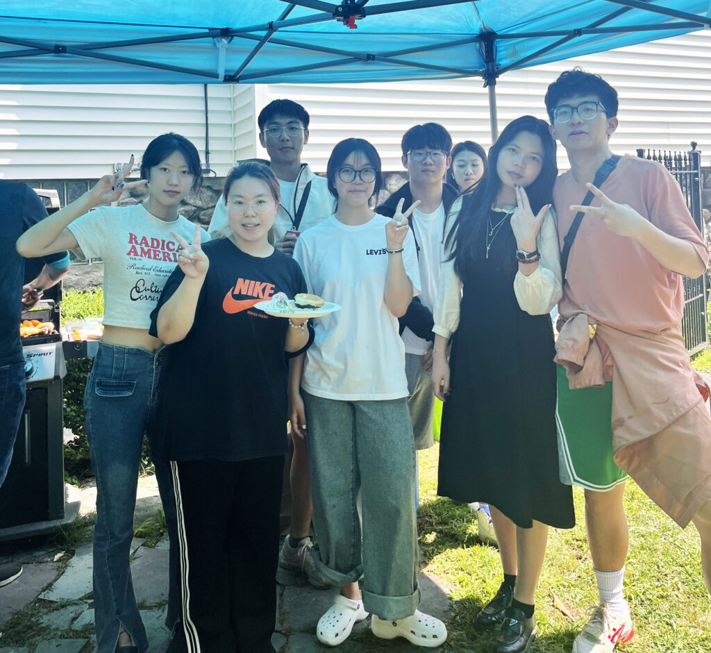 Picture of HFUT students smiling at a barbecue