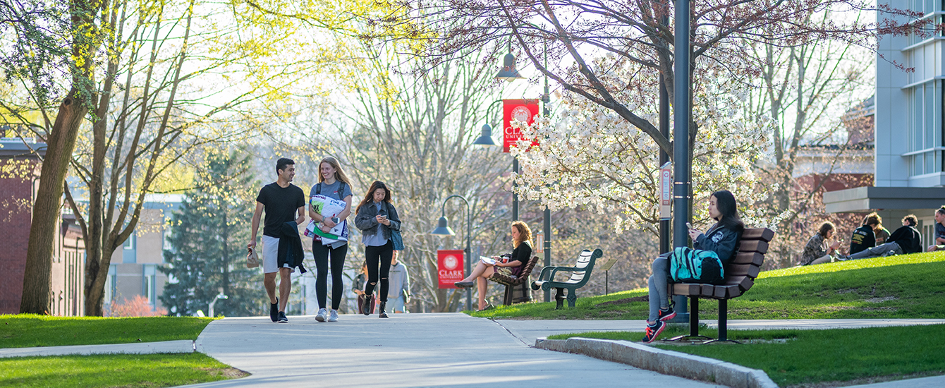 Students walking across green