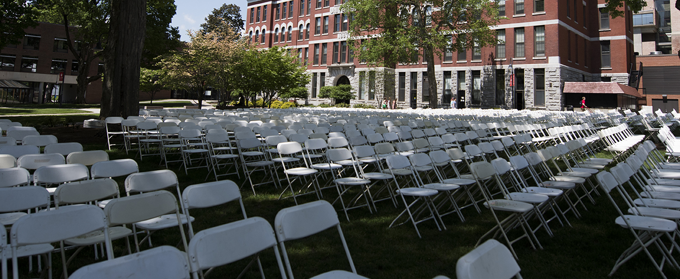 chairs being setup on the campus lawn