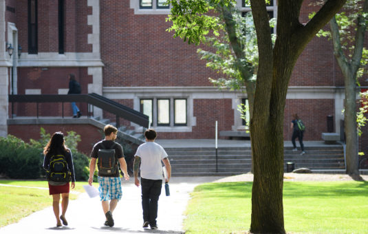 students walking towards building