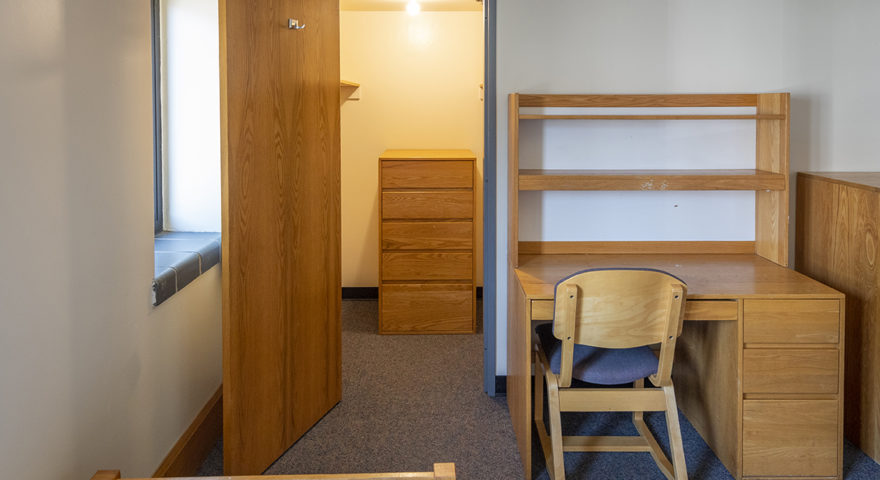 Maywood Hall dorm room with desk and closet
