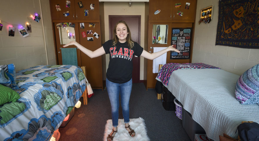 Girl standing in Wright Hall dorm room