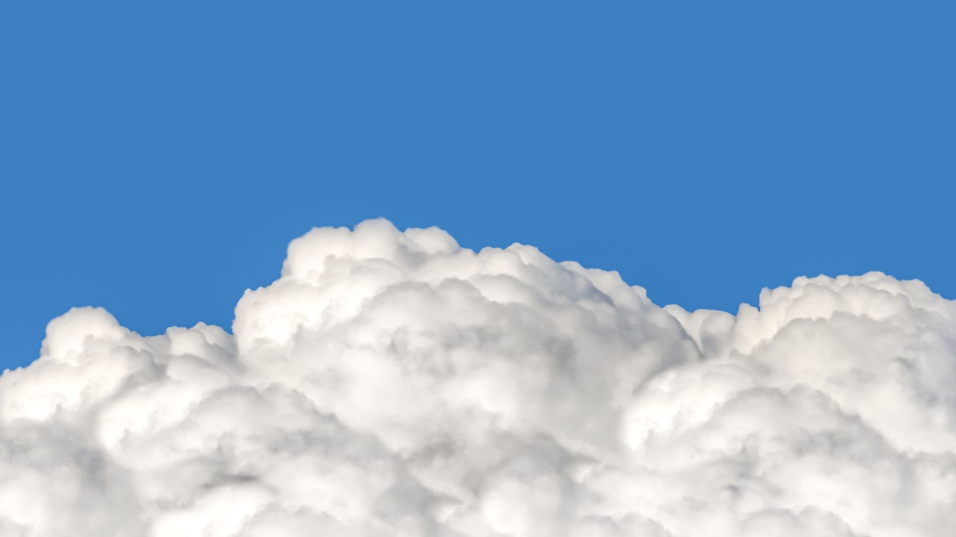 Photo of white clouds on a blue background