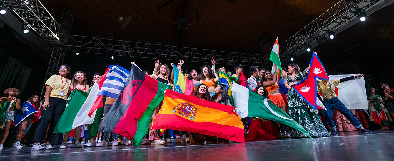 International students on stage with flags