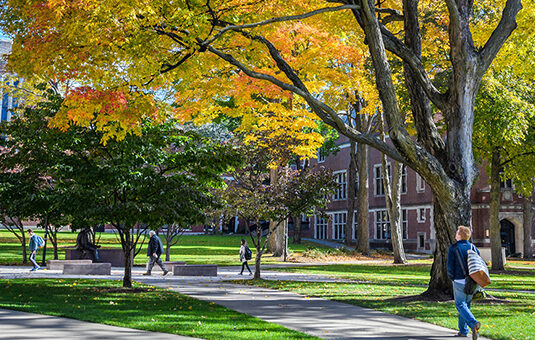 campus green with fall leaves