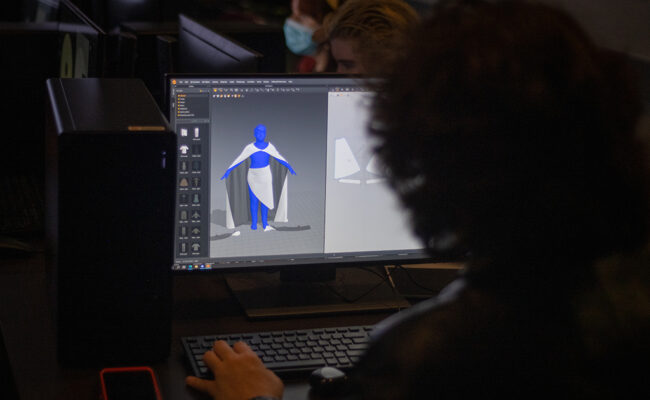 Student looking at costume on screen