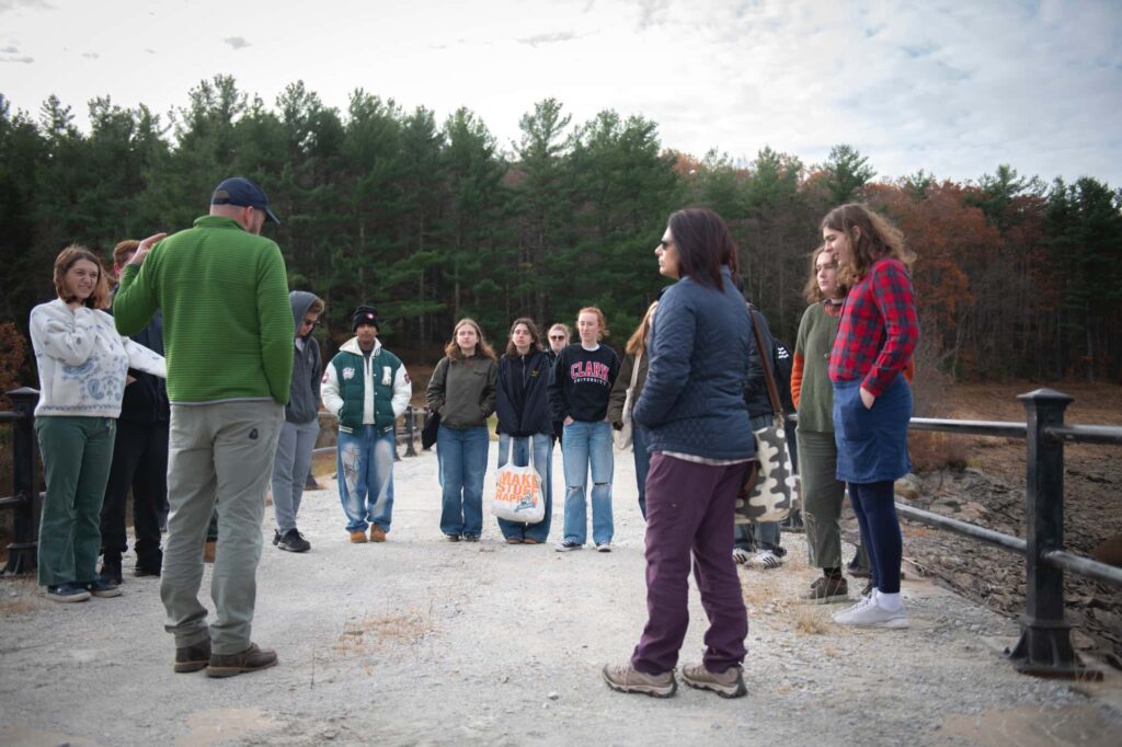 Students study a dam near Worcester