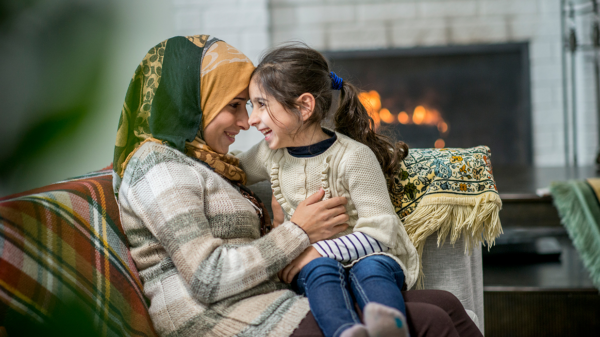 Refugee mother and daughter in new home