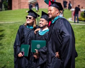 Graduates Clare Robbins, Luis Santos, and David Muradian.