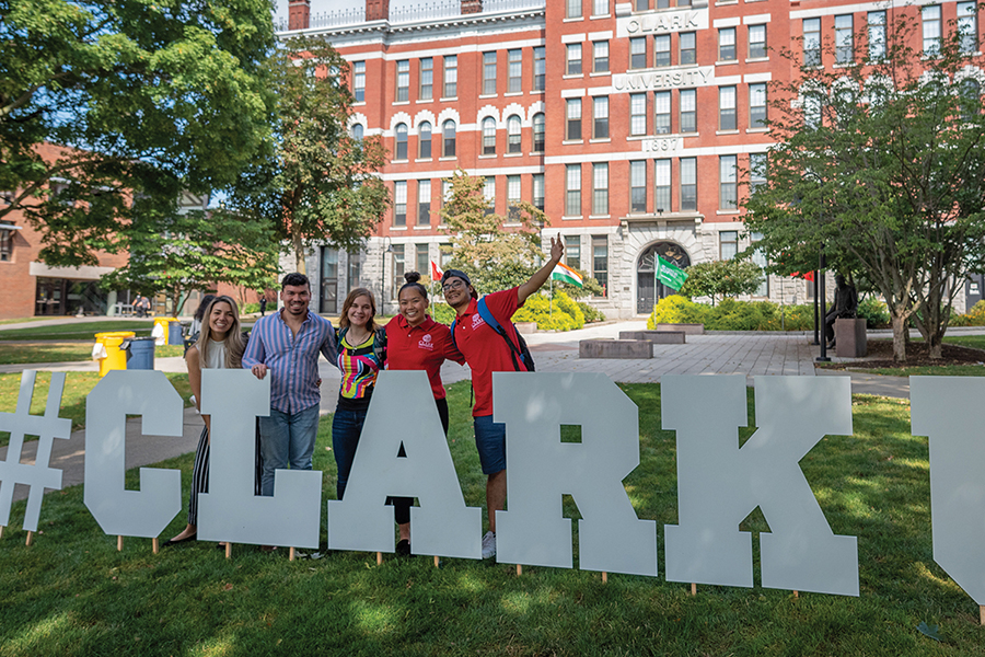 graduate students standing behind hastag sign