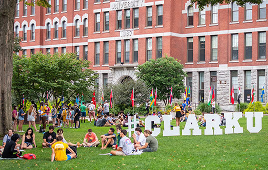 Transfer students sitting on the green