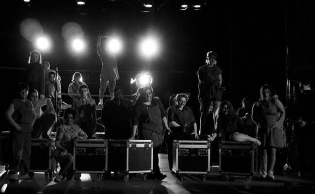 theatre arts - black and white image of students on stage